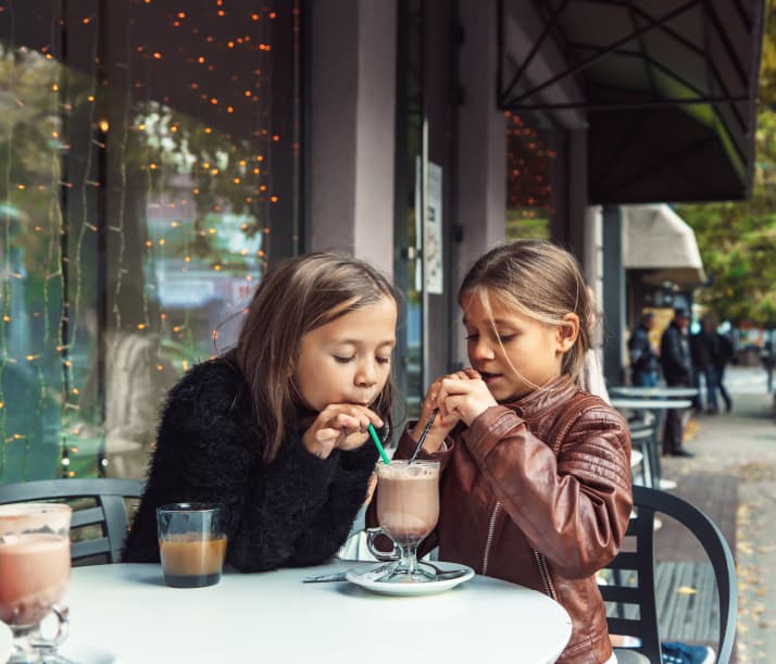 Girls sharing cocoa