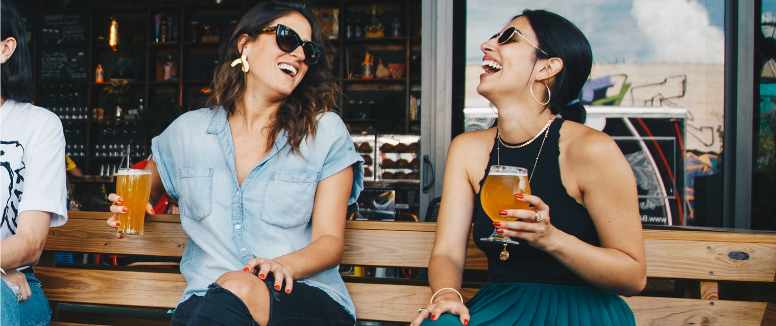 Women laughing and enjoying a beer in Fort Collins